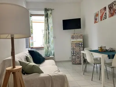 a living room with a couch and a table at Home Rome in Rome