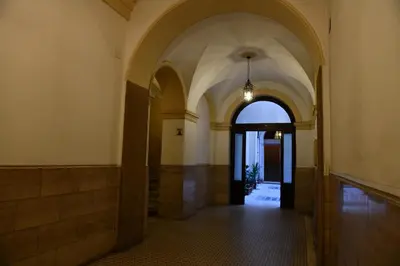 an empty hallway with an archway in a building at Maison Margaret in Rome