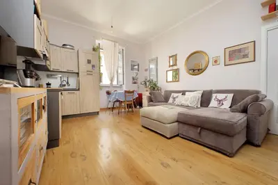 a living room with a couch and a table at Cozy Esquilino - My Extra Home in Rome