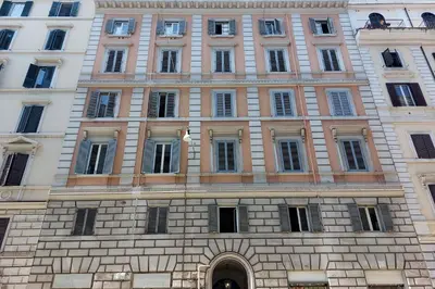 a large brick building with many windows at Cozy Esquilino - My Extra Home in Rome