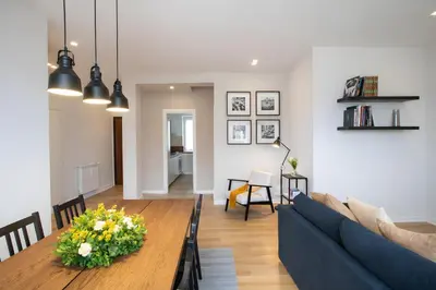 a living room with a couch and a table at Sunny Monteverde Apartment - Near Trastevere by RHR in Rome