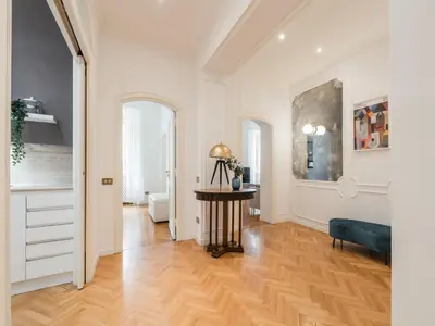 a living room with a table and a couch at The Best Rent - Splendid three-bedroom apartment near the Trevi Fountain in Rome