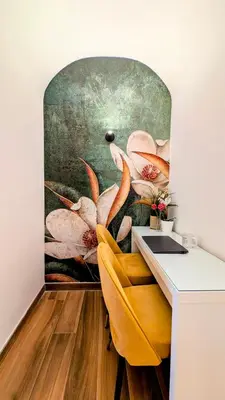 a room with a desk and a painting on the wall at Giorgina Garden&Rooms in Rome