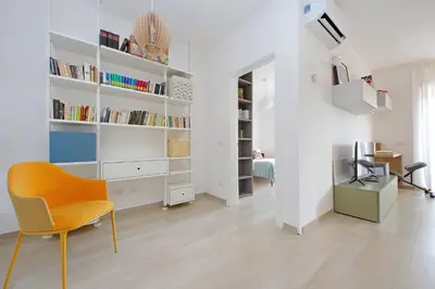 a white room with a chair and a desk at YCH-Rifugio incantato sul Tevere in Rome