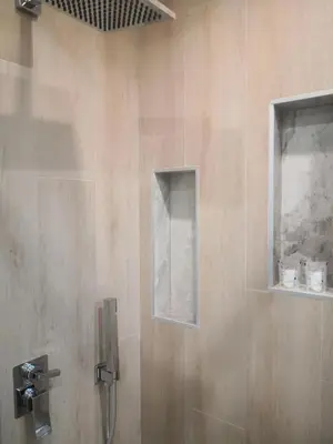 a bathroom with a shower with a glass door at Gidà Room Metro B Monti Tiburtini Roma in Rome