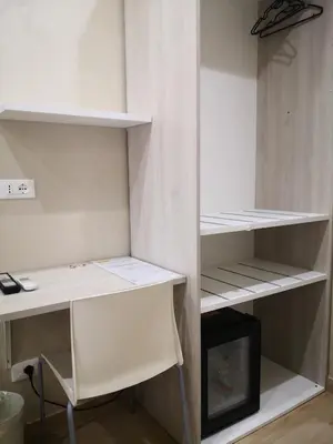 a white closet with a desk and a desk and shelves at Gidà Room Metro B Monti Tiburtini Roma in Rome