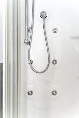 a shower with a hose hanging on a wall at RomeCornelia Apartment - Musei Vaticani - San Pietro in Rome