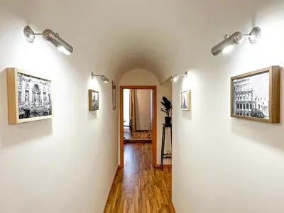 a hallway with paintings on the walls of a room at Giulio Cesare 237 in Rome