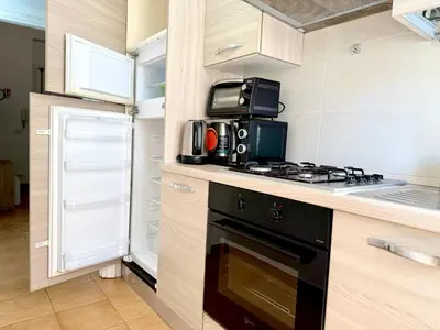 a kitchen with a stove and a refrigerator at Bella Boutique in Rome