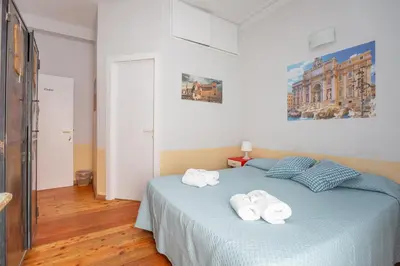 a bathroom with a shower and a toilet and a sink at Vatican Rooms Haven in Rome