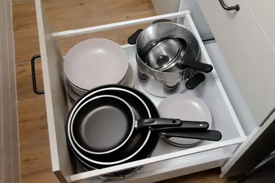 a drawer filled with pots and pans in a kitchen at Ostiense upsidedown in Rome