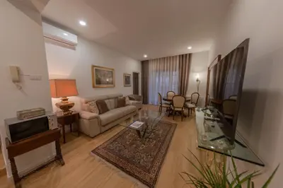 a living room with a couch and a tv at Gaia's home in Vatican in Rome