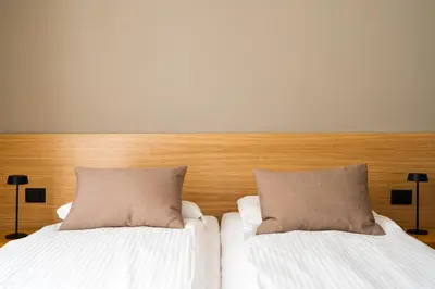 two beds with pillows sitting next to each other at Testaccio Design Apartment Rome in Rome