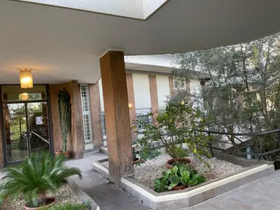 a courtyard with potted plants in front of a building at Loft 643 in Rome