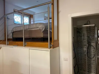 a bunk bed in a room with a mirror at Loft 643 in Rome