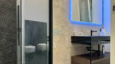 a bathroom with a sink and a mirror at Chic Studio in piazza Bologna in Rome