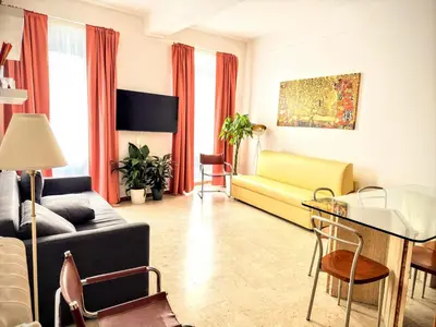 a living room with a couch and a table at colosseobb in Rome