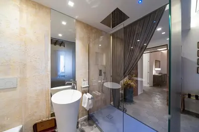 a bathroom with a sink and a shower at Trastevere Luxury, ampia e confortevole location sospesa tra design e storia in Rome
