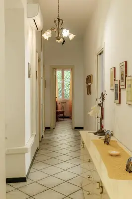 a bathroom with a sink and a hallway at Appartamento a Roma a due passi da Trastevere in Rome
