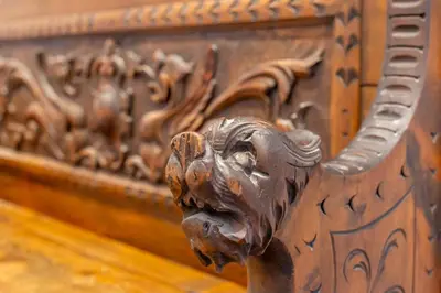 a metal lion head on the side of a bed at iFlat Bright Brand New 2-Bedroom Apt in Monti in Rome