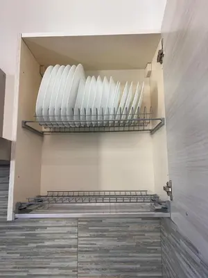 a room with a row of white plates on a wall at Smart Home in Rome