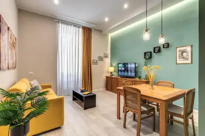a living room with a table and a couch at Pretorius Charming New Apt in Rome
