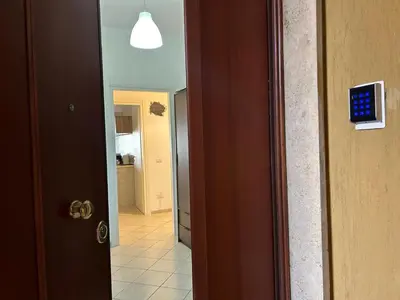 a door leading to a hallway with a hallway at Peppe's Bed in Rome