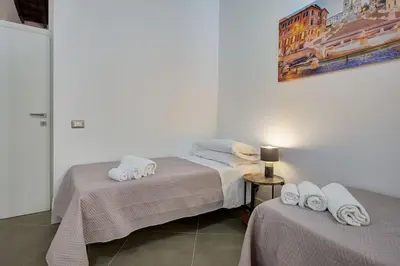 a bedroom with two beds with towels on them at Domus Capitolina Pantheon in Rome