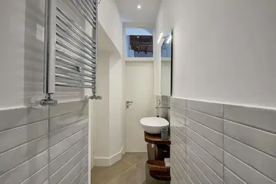 a small bathroom with a sink and a toilet at Domus Capitolina Pantheon in Rome