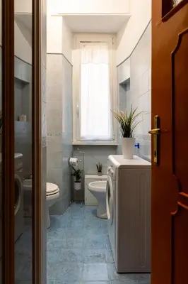 a bathroom with a toilet and a sink at Orange Nest in Rome