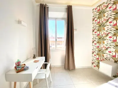 a room with a white desk and a window at Prince of Rome Superior Rooms in Rome