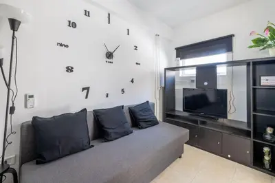 a living room with a couch and a tv at Casa Gemelli - Metro per il centro di Roma - in Rome