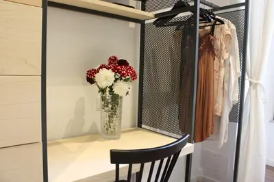 a vase of flowers sitting on a shelf in a closet at Roma Capoccia in Vaticano in Rome