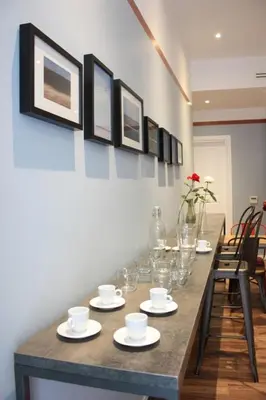 a long table with glasses and cups on it at Roma Capoccia in Vaticano in Rome