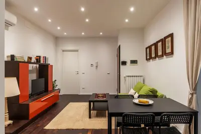 a living room with a couch and a table at GuestHost - Sant'Agnese & Nomentana Cozy Apartment in Rome