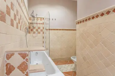 a bathroom with a shower and a sink and a toilet at The Vatican Dream 3BDR Apartment in Rome