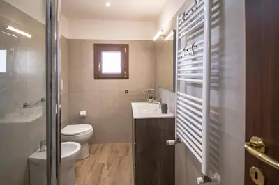 a small bathroom with a toilet and a sink at Roof Terrace Sophie, Repubblica apartment Termini Station in Rome