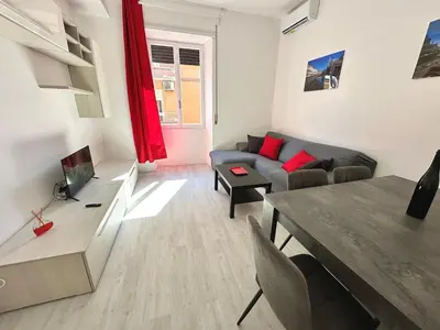 a living room with a couch and a table at St Pietro city center near subway in Rome