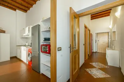 a kitchen with a refrigerator and a washing machine at Conti Ripetta house in Rome