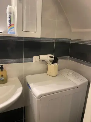 a small bathroom with a toilet and a sink at La casa di vasco in Rome