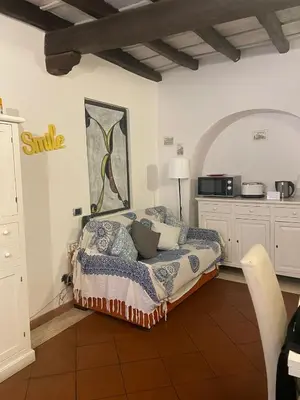 a bedroom with a bed in the corner of a room at La casa di vasco in Rome