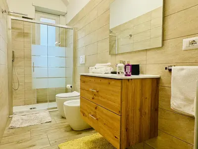 a bathroom with a sink and a toilet and a shower at Casa Flora in Rome