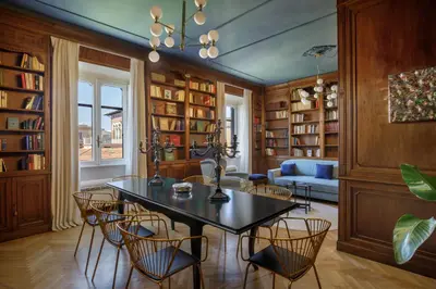 a dining room with a table and chairs at Daplace - Lavinia Apartment in Rome