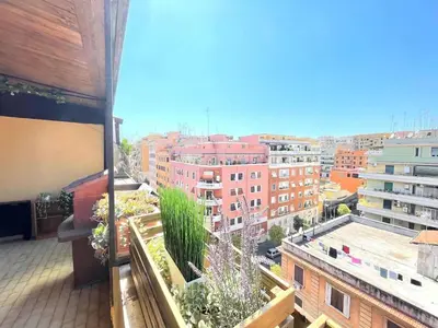 a balcony with a view of a city at Green Holiday Penthouse in Rome