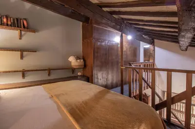 a room with a bed in a room with wooden walls at Suite Benedetta - Trastevere Luxury in Rome