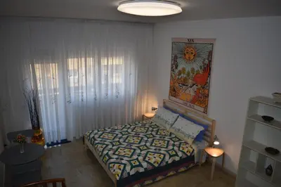 a bedroom with a bed and a painting on the wall at Vacanze Romane in Rome