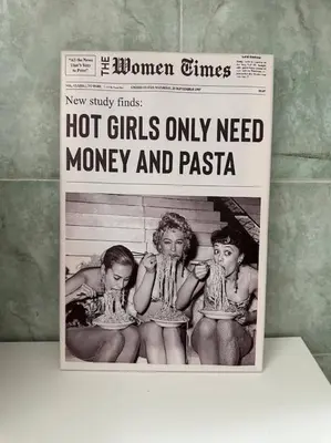 a newspaper with two girls in a bath tub at Bella Roma Stay in Rome