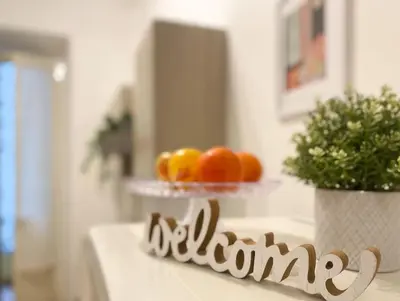 a plate of oranges on a table with the word autism at Via Veneto - Domus Juliae in Rome