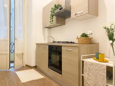 a kitchen with a stove and a sink at Via Veneto - Domus Juliae in Rome
