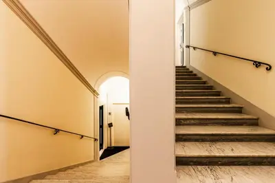 a stairway in a building with a hallway at RANALLI Suite in Rome